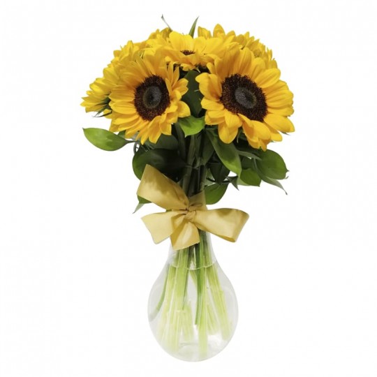 Arrangement of sunflowers in a glass vase Elegance