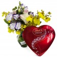 Arrangement with Roses, Lisianthus, Golden Rain Orchids and Lindt Heart G