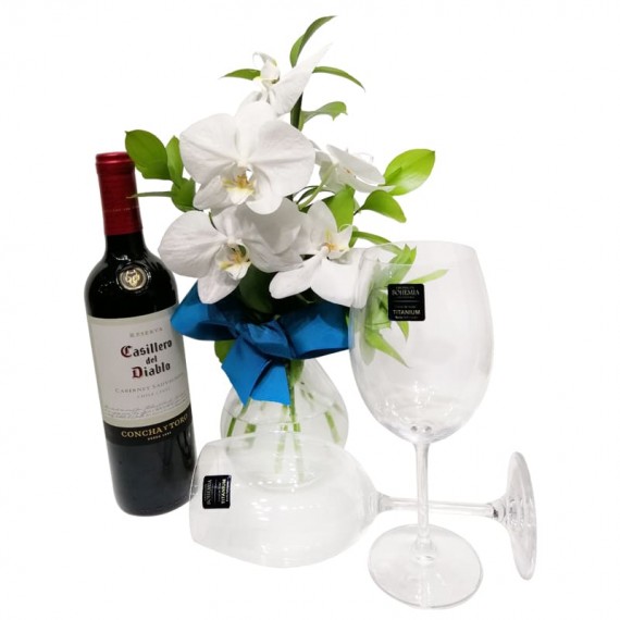 Arrangement with White Orchids, Casillero del Diablo Wine and Glasses