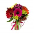 Gerberas and astromeliads arrangement in glass vase